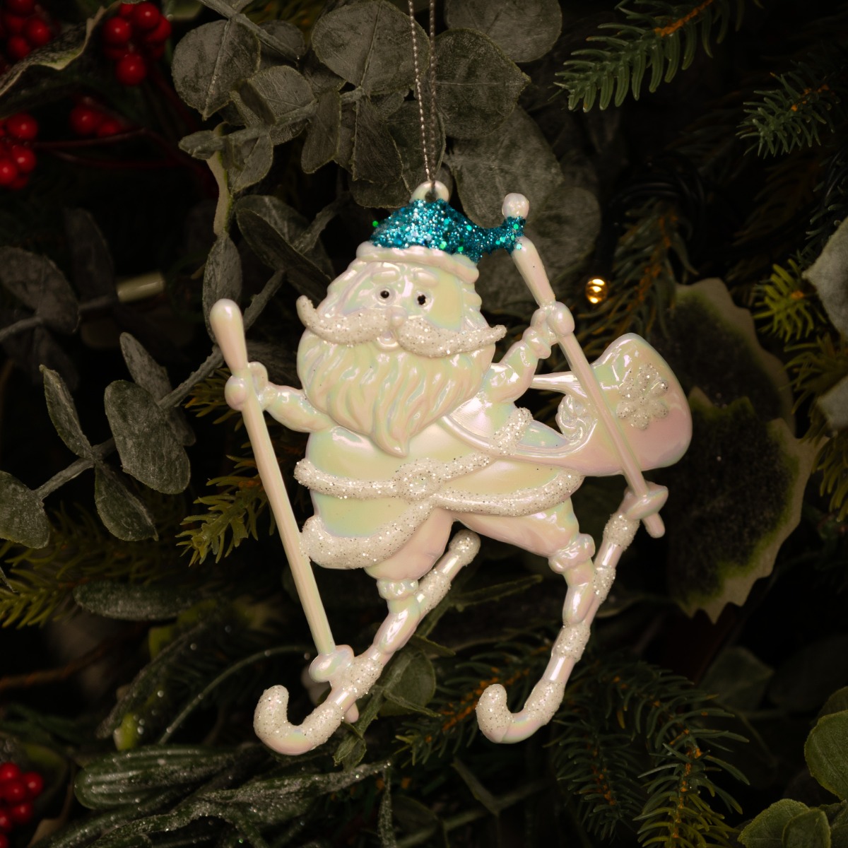 White Iridescent Skiing Santa With Blue Hat - Christmas Tree Decoration